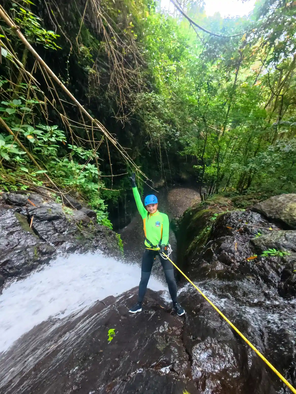 Guest at the top of a 24-metre waterfall rappel