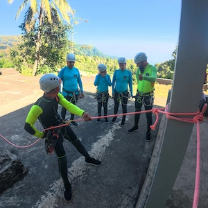 Guides setting up ropes before a canyoning descent